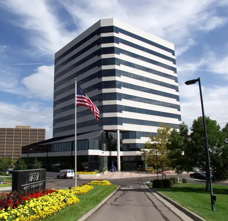 Exterior view of 7887 East Belleview Avenue with American flag at Opus Virtual Office in Denver, CO